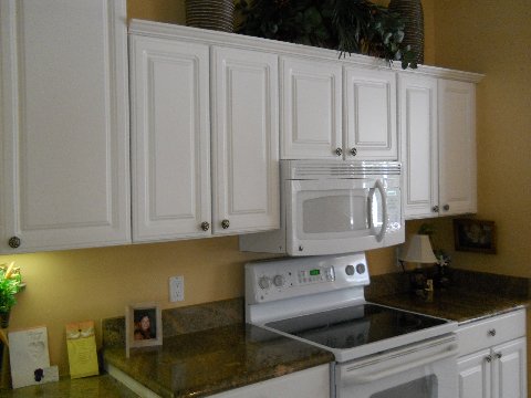 White cabinets before refacing by Kitchen Facelifts