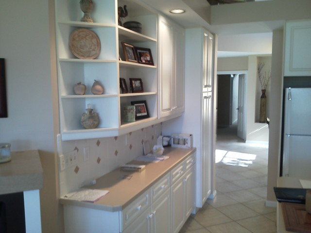 Before cabinet refacing, kitchen shelves and counter
