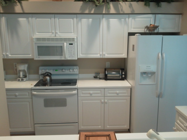 All white kitchen cabinets before Kitchen Facelifts cabinet refacing