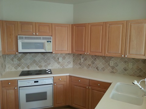 Outdated cabinets in the kitchen before refacing done by Kitchen Facelifts in Southwest Florida