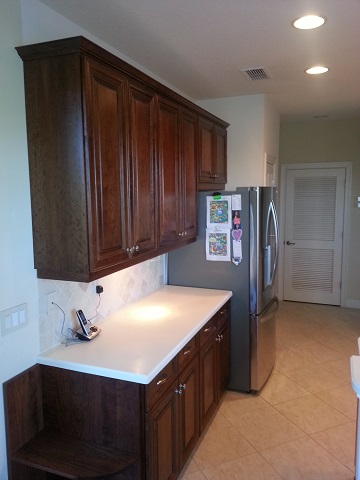 Beautiful updated dark wood kitchen cabinets after refacing by Kitchen Facelifts in Southwest Florida
