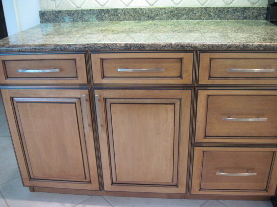These cabinets have been refaced by Kitchen Facelifts to give them a warm tone and an updated look.